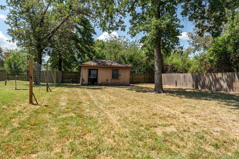 Level, fenced backyard
